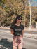 products/mockup-of-a-girl-wearing-a-round-neck-tee-on-the-street-19615.png