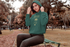 products/mockup-of-a-woman-wearing-a-pullover-hoodie-at-a-park-30117_1.png