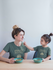 products/mom-and-daughter-wearing-t-shirts-mockup-during-a-fun-breakfast-a20283.png