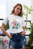 products/tee-mockup-of-a-girl-with-a-coy-smile-by-a-balcony-26628.png