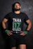 products/t-shirt-mockup-of-an-mma-wrestler-against-a-wall-26255.png